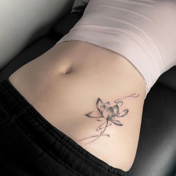 girl belly tattoo